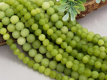 Load image into Gallery viewer, Peridot Green - Matte Jade - 6/8mm - 15&quot; Strand
