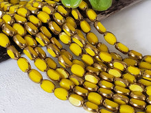 Load image into Gallery viewer, Canary Yellow Bronze Faceted Rectangular Crystals - 14&quot; Full Strand
