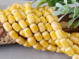 Tuscany Yellow AB Laser Edge Crystal Barrels - 9x6mm - 11" Strand