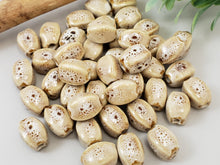 Load image into Gallery viewer, Latte - Oval Melon Glazed Porcelain Beads - 12x10mm - 10pcs
