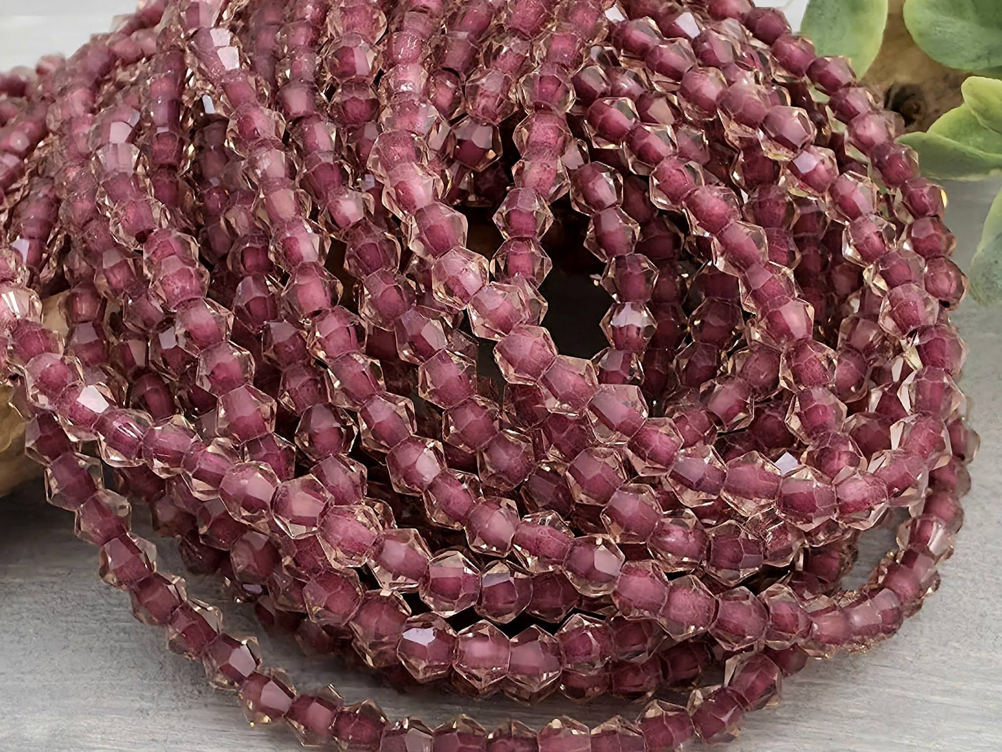Raspberry Wine Lined Crystal Bicone - 4mm - 10" Strand